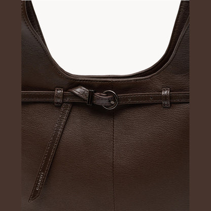 Close-up of the belted front strap with gunmetal buckle